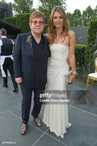 Sir Elton John and Elizabeth Hurley attend the Woodside Gallery Dinner in benefit of Elton John AIDS Foundation in partnership with BVLGARI at...