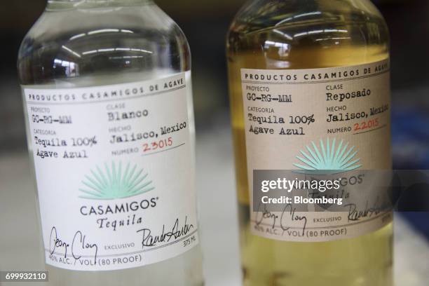 Bottles of Casamigos blanco and reposado tequilas are arranged for a photograph at a liquor store in Los Angeles, California, U.S., on Thursday, June...