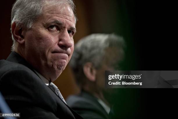 Martin Gruenberg, chairman of the Federal Deposit Insurance Corp. , listens during a Senate Banking Committee hearing in Washington, D.C., U.S., on...