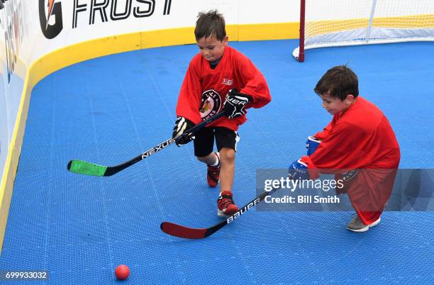 Youth hockey players participate in the Top Prospects Hockey Clinic at the NHL Centennial Fan Arena on June 22, 2017 at the United Center as part of...