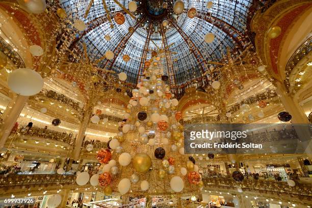 Large Christmas tree decorating Galeries Lafayette store floor on January 8, 2017 in Paris, France.