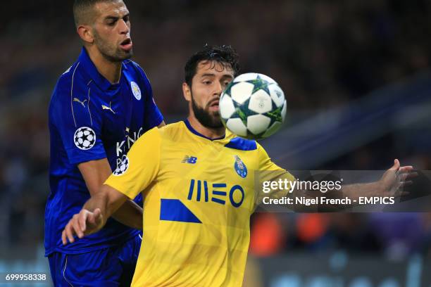 Leicester City's Islam Slimani and FC Porto's Augusto Felipe battle for the ball