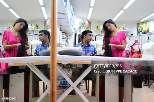 Dubai based fashion designer Aiisha Ramadan is seen on June 10, 2017 in her studio in Dubai, United Arab Emirates. From Dolce & Gabbana to Michael...