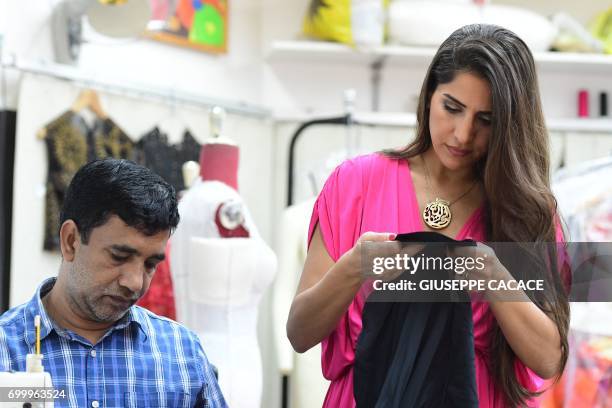 Dubai based fashion designer Aiisha Ramadan is seen on June 10, 2017 in her studio in Dubai, United Arab Emirates. From Dolce & Gabbana to Michael...