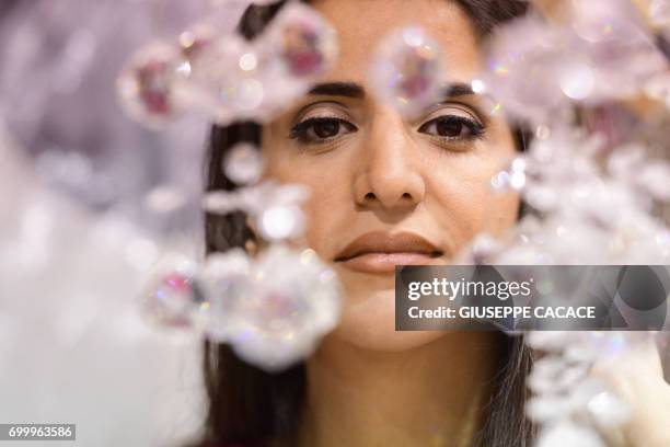 Dubai based fashion designer Aiisha Ramadan is seen on June 10, 2017 in her studio in Dubai, United Arab Emirates. From Dolce & Gabbana to Michael...