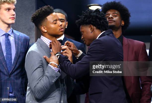 De'Aaron Fox helps adjust the bowtie of Markelle Fultz before the first round of the 2017 NBA Draft at Barclays Center on June 22, 2017 in New York...