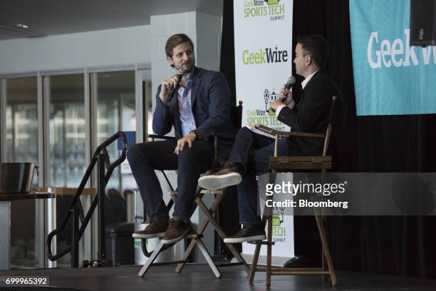 Tucker Kain, chief financial officer of Los Angeles Dodgers LLC, left, speaks during the GeekWire Sports Tech Summit in Seattle, Washington, U.S., on...