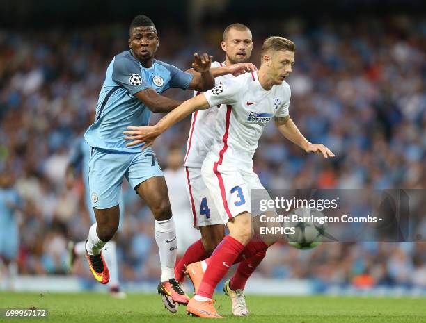 Manchester City's Kelechi Iheanacho and Steaua Bucharest's Bogdan Mitrea battle for the ball