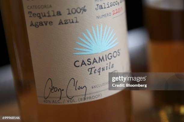 Bottle of Casamigos reposado tequila is arranged for a photograph at a restaurant in Los Angeles, California, U.S., on Thursday, June 22, 2017....