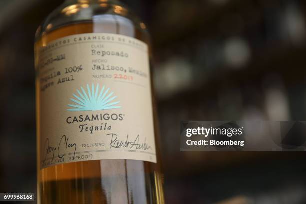 Bottle of Casamigos reposado tequila is arranged for a photograph at a restaurant in Los Angeles, California, U.S., on Thursday, June 22, 2017....