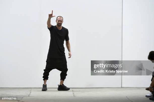 Designer Boris Bidjan Saberi acknowledges the audience during the runway during the Boris Bidjan Saberi Menswear Spring/Summer 2018 show as part of...