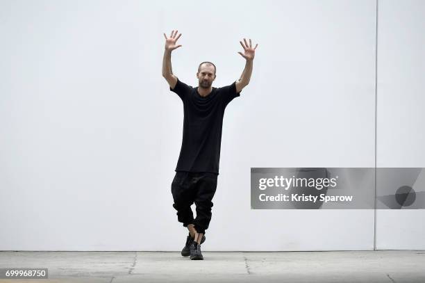 Designer Boris Bidjan Saberi acknowledges the audience during the runway during the Boris Bidjan Saberi Menswear Spring/Summer 2018 show as part of...