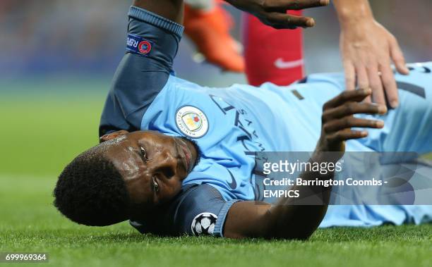 Manchester City's Kelechi Iheanacho receives help from Steaua Bucharest's Bogdan Mitrea after going down injured