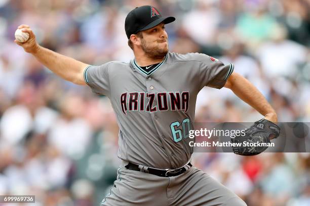 Pitcher J.J. Hoover of the Arizona Diamondbacks throws in the eighth inning aganst the Colorado Rockies at Coors Field on June 22, 2017 in Denver,...