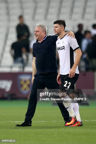 Astra Giurgiu manager Marius Sumudica celebrates with Cristian Sapunaru after the final whistle