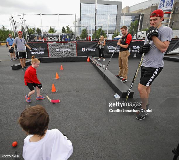 Nico Hischier and Gabriel Vilardi work with children during the 2017 NHL Draft top prospects hockey clinic and media availabilty at the United Center...