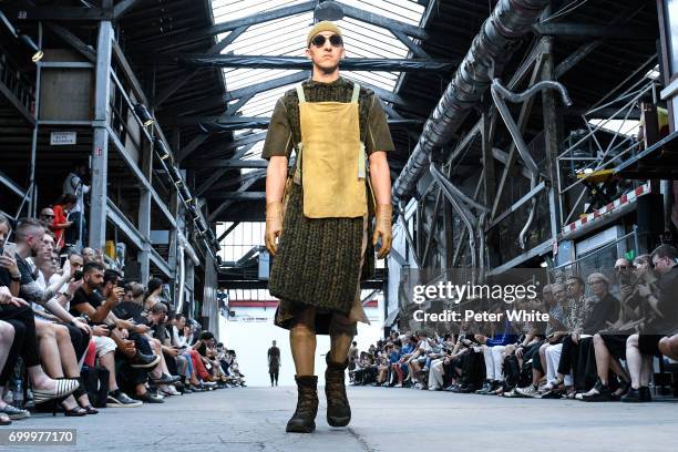 Model walks the runway during the Boris Bidjan Saberi Menswear Spring/Summer 2018 show as part of Paris Fashion Week on June 22, 2017 in Paris,...