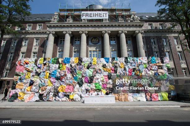 Moreno Occhiolini, Benno Maubach, Uwe Schmitz and HA Schult during the unveiling of the new art project 'Freiheitswand' in front of the Andreas...