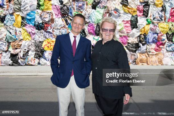 Uwe Schmit and HA Schult during the unveiling of the new art project 'Freiheitswand' in front of the Andreas Quartier on June 22, 2017 in...