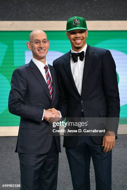 Jayson Tatum the third overall pick selected by the Boston Celtics smiles with Adam Silver during the 2017 NBA Draft on June 22, 2017 at Barclays...