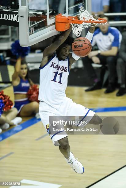 Kansas guard Josh Jackson dunks against Purdue in the Sweet Sixteen round of the NCAA Tournament at Sprint Center in Kansas City, Mo., on March 23,...