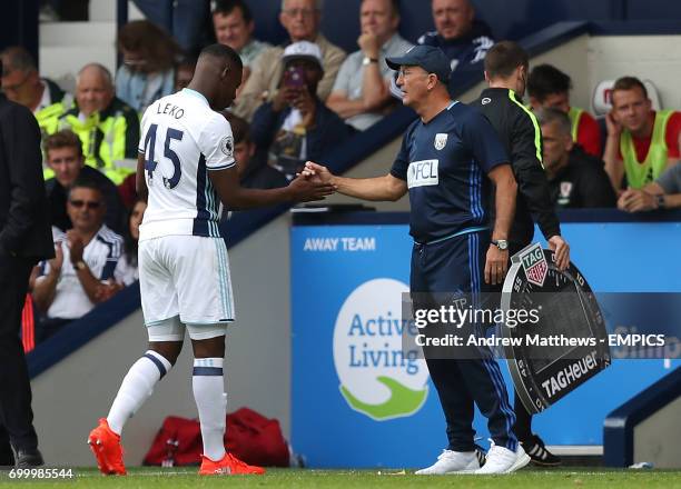 West Bromwich Albion's Jonathan Leko shakes hands with manager Tony Pulis as he leaves the pitch after picking up an injury.