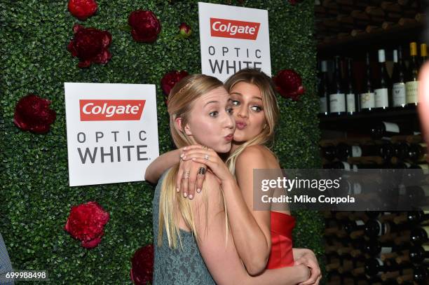 Kelsea Ballerini poses with a fan during a Legendary Night Out With Kelsea Ballerini Presented by Colgate Optic White on June 22, 2017 in New York...