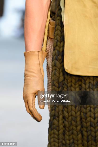 Model, glove detail, walks the runway during the Boris Bidjan Saberi Menswear Spring/Summer 2018 show as part of Paris Fashion Week on June 22, 2017...