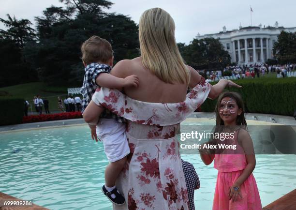 Ivanka Trump , daughter and assistant to President Donald Trump, shares a moment with her daughter Arabella Rose Kushner during during a...
