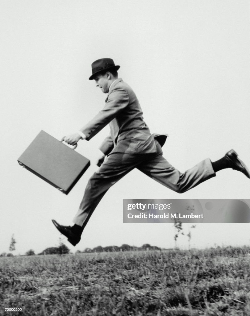 COMMUTER RUNNING TO THE OFFICE