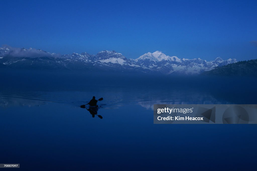 USA, Alaska, Glacier Bay, Queen Inlet, sea kayaker, reflections