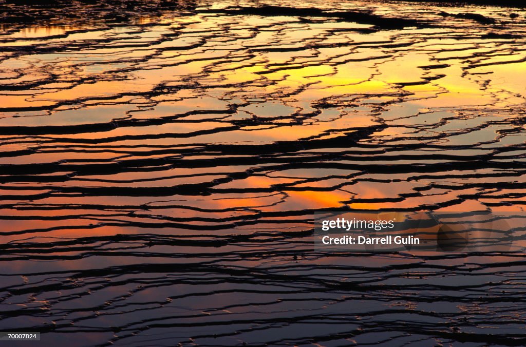 USA, Wyoming, sun reflecting on Midway Geyser Basin, sunset