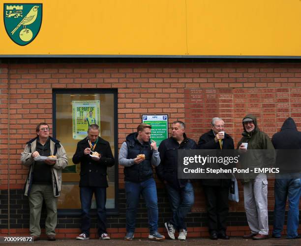 Fans wait outside Carrow Road, Norwich