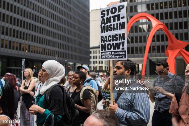 Demonstrators gather for a candlelight vigil for Nabra Hassanen and other victims of hate crimes and state violence held at Federal Plaza in Chicago...