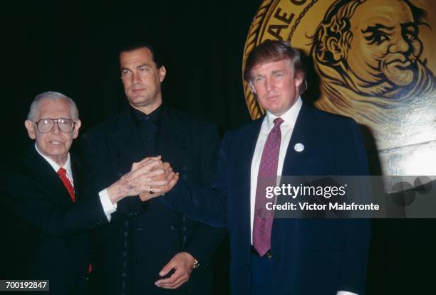 Comedian Milton Berle , actor Steven Seagal and American real estate magnate Donald Trump at a Friar's Club roast for Seagal, New York City, 6th...