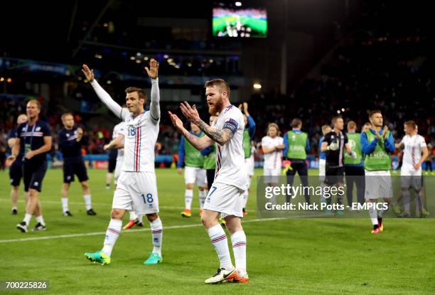 Iceland's Theodor Elmar Bjarnason and Aron Gunnarsson celebrate after the game