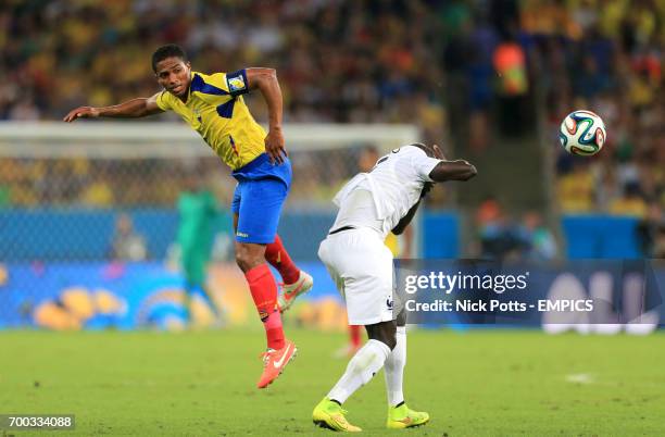 Ecuador's Antonio Valencia and France's Paul Pogba battle for the ball