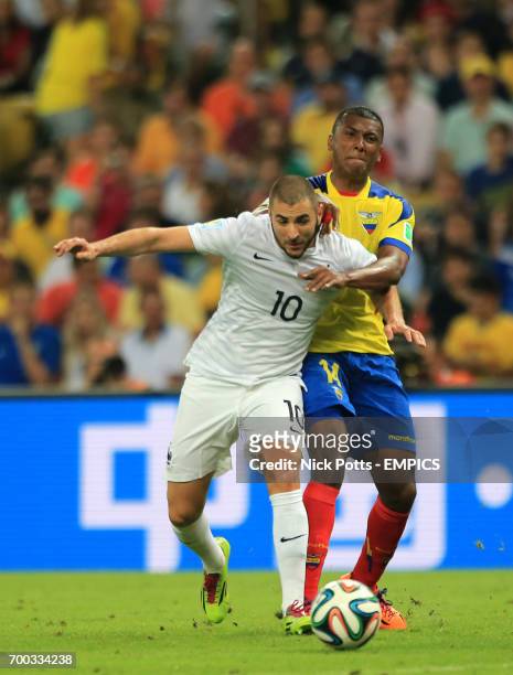 Ecuador's Oswaldo Minda and France's Karim Benzema battle for the ball