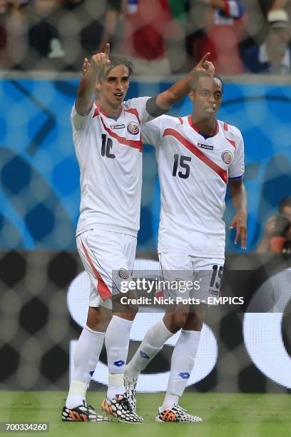 Costa Rica's Bryan Ruiz celebrates scoring their first goal of the game with team-mate Junior Diaz