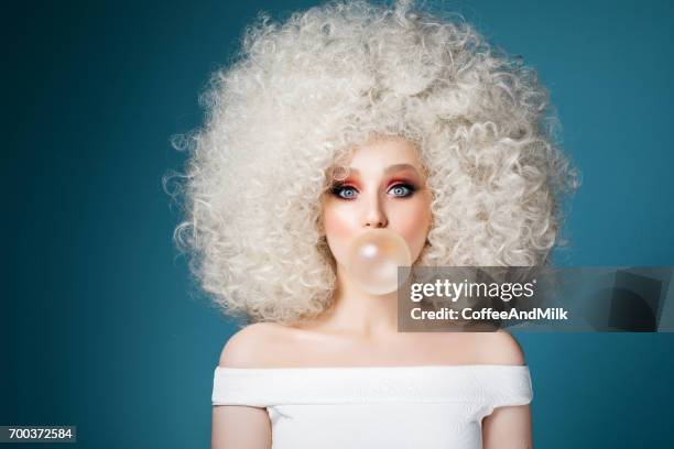 pretty woman with extravagant hairstyle - bubble gum stock pictures, royalty-free photos & images