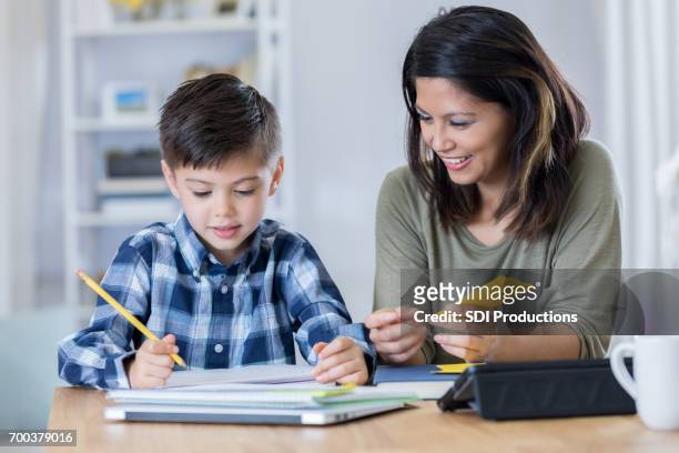 homeschool mom helps son with assignment - flash card stock pictures, royalty-free photos & images