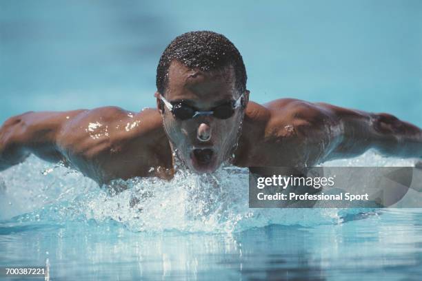 Suriname swimmer Anthony Nesty competes to finish in first place to win the gold medal in the 100 metre butterfly event at the 1991 World Aquatics...