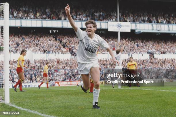 English footballer Chris Waddle celebrates after scoring one of two goals for Tottenham Hotspur against Watford in a Division One league match at...