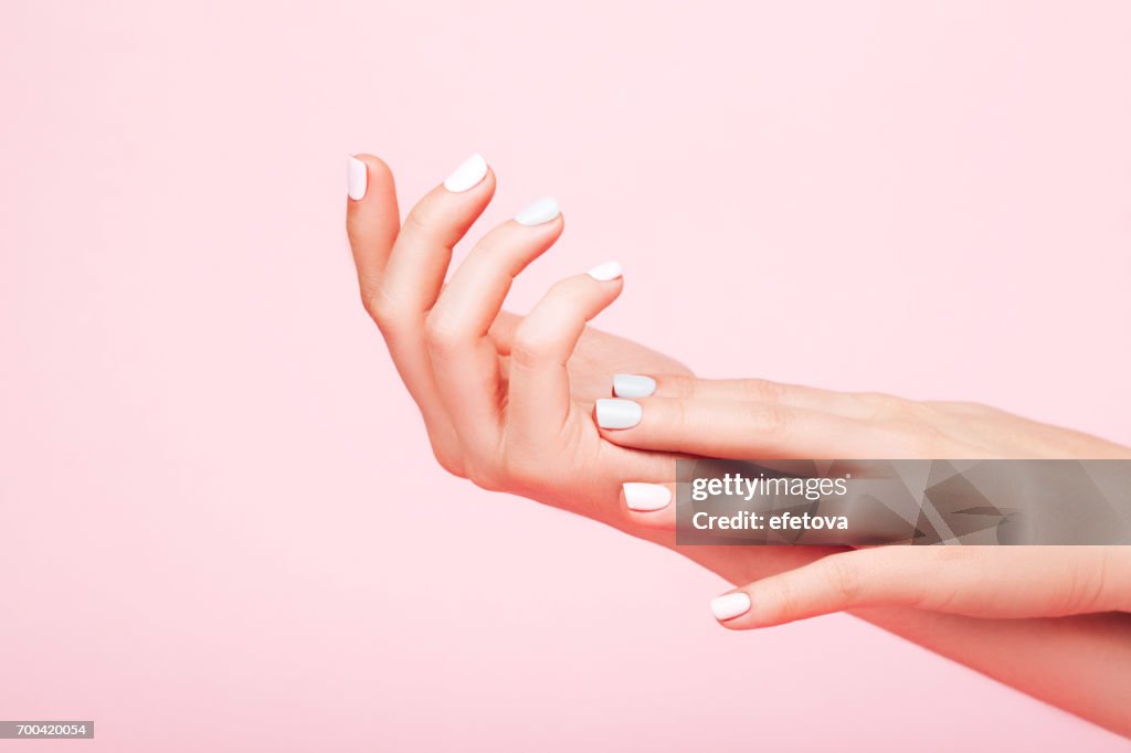 Tender hands with perfect manicure