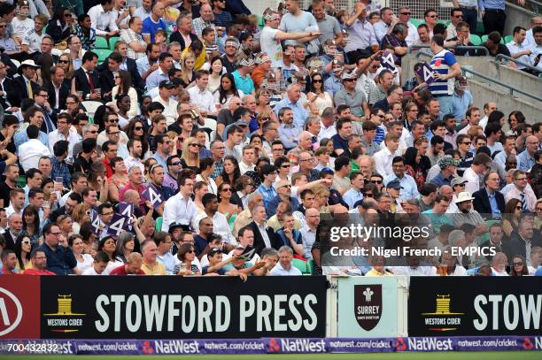 Fans soak up the atmosphere in the stands at the Kia Oval