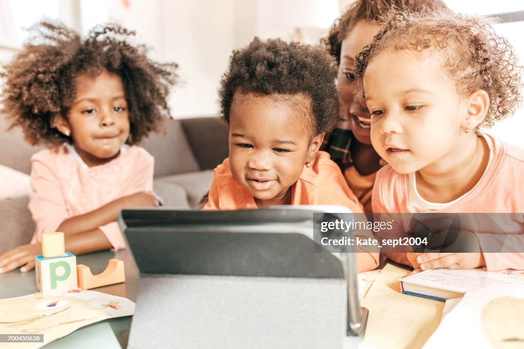 Kids Watching Video High-Res Stock Photo - Getty Images