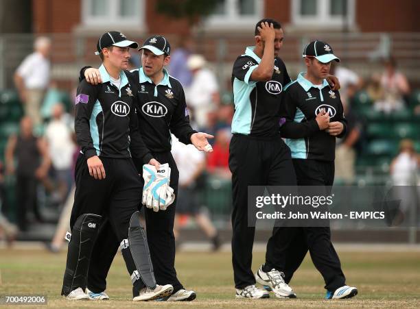 Surrey's Rory Burns, captain Gary Wilson, George Edwards and Steven Davies