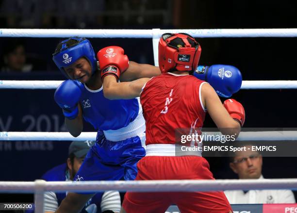 India's Laishram Devi in action against Mozambique's Maria Machongua in the Women's Light Semi-final 2 at the SECC, during the 2014 Commonwealth...