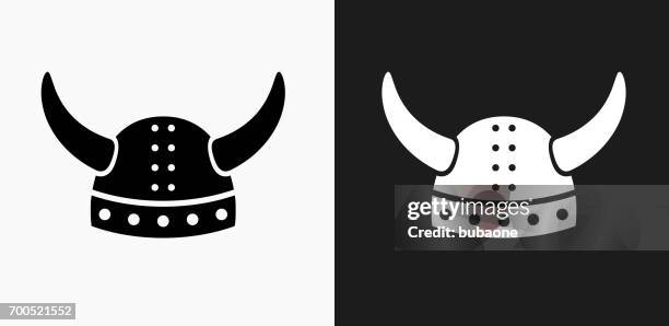 viking helmet icon on black and white vector backgrounds - viking helmet stock illustrations