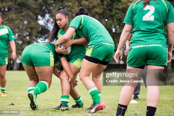 female rugby players tackling in action - grittywomantrend stock pictures, royalty-free photos & images